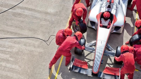 people fixing a race car